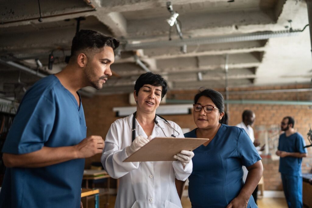 Doctor talking to colleagues in a medical clinic