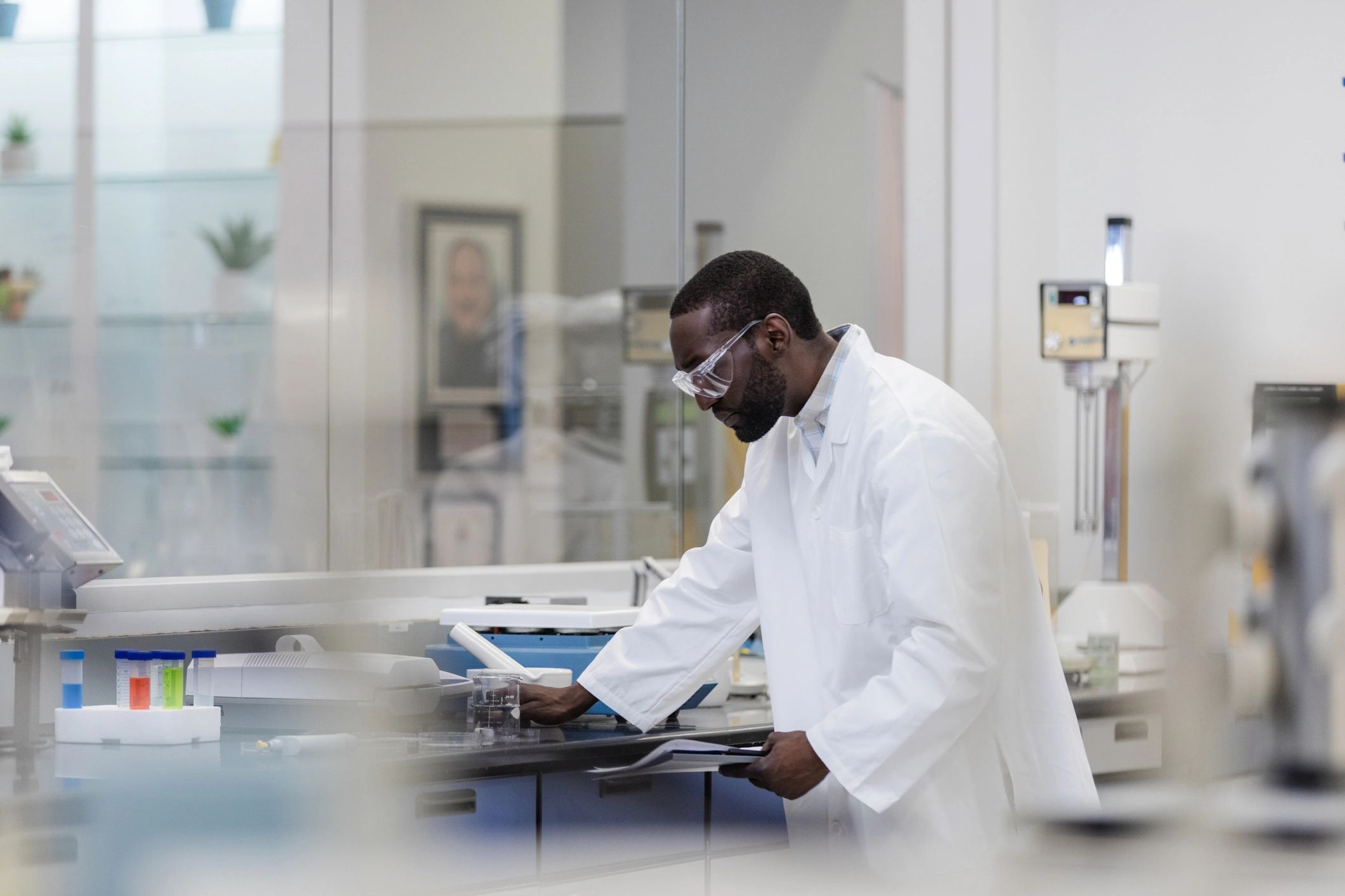 Technician reviewing a report in a laboratory setting
