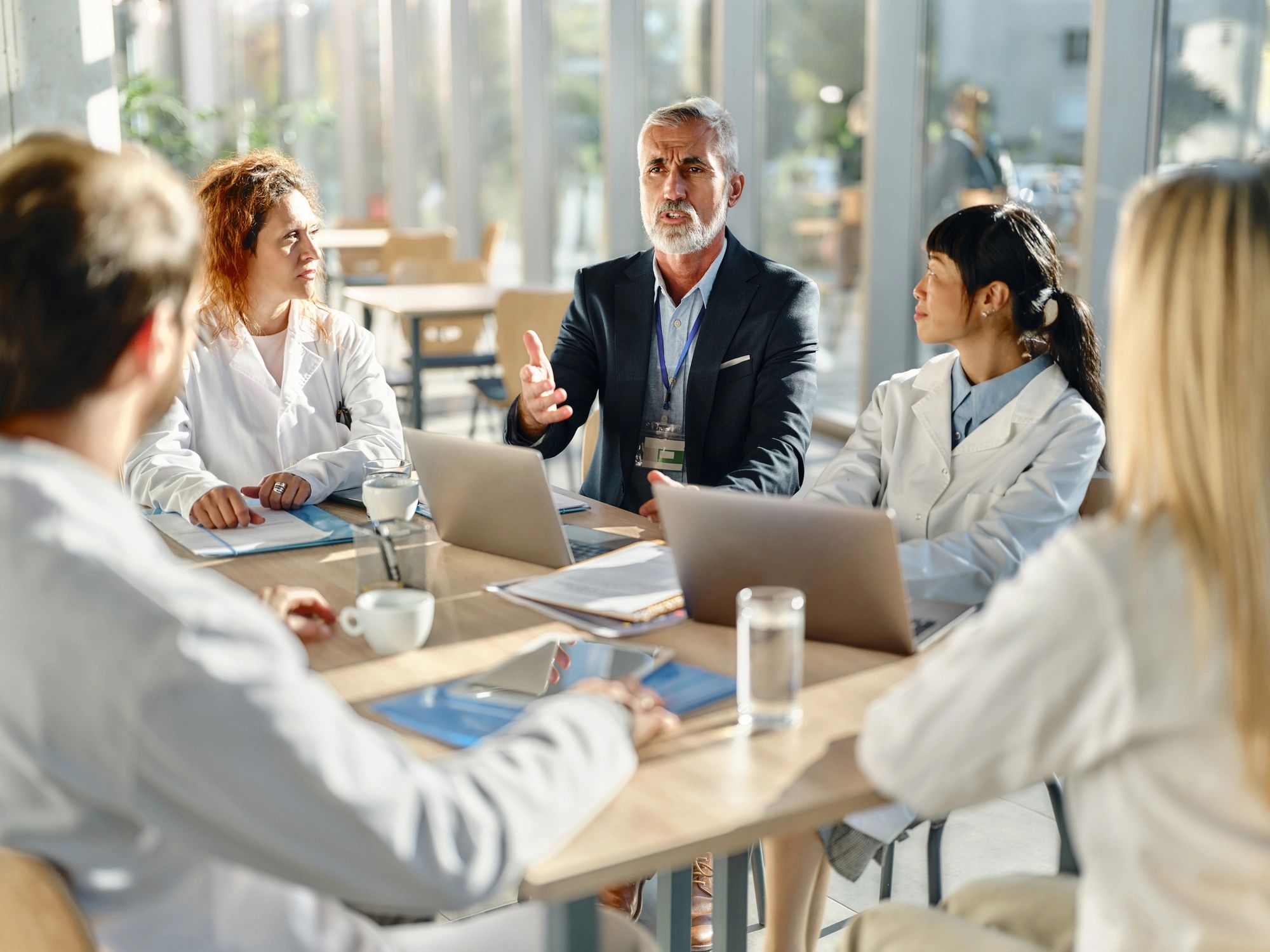 Hospital leadership meeting with medical experts