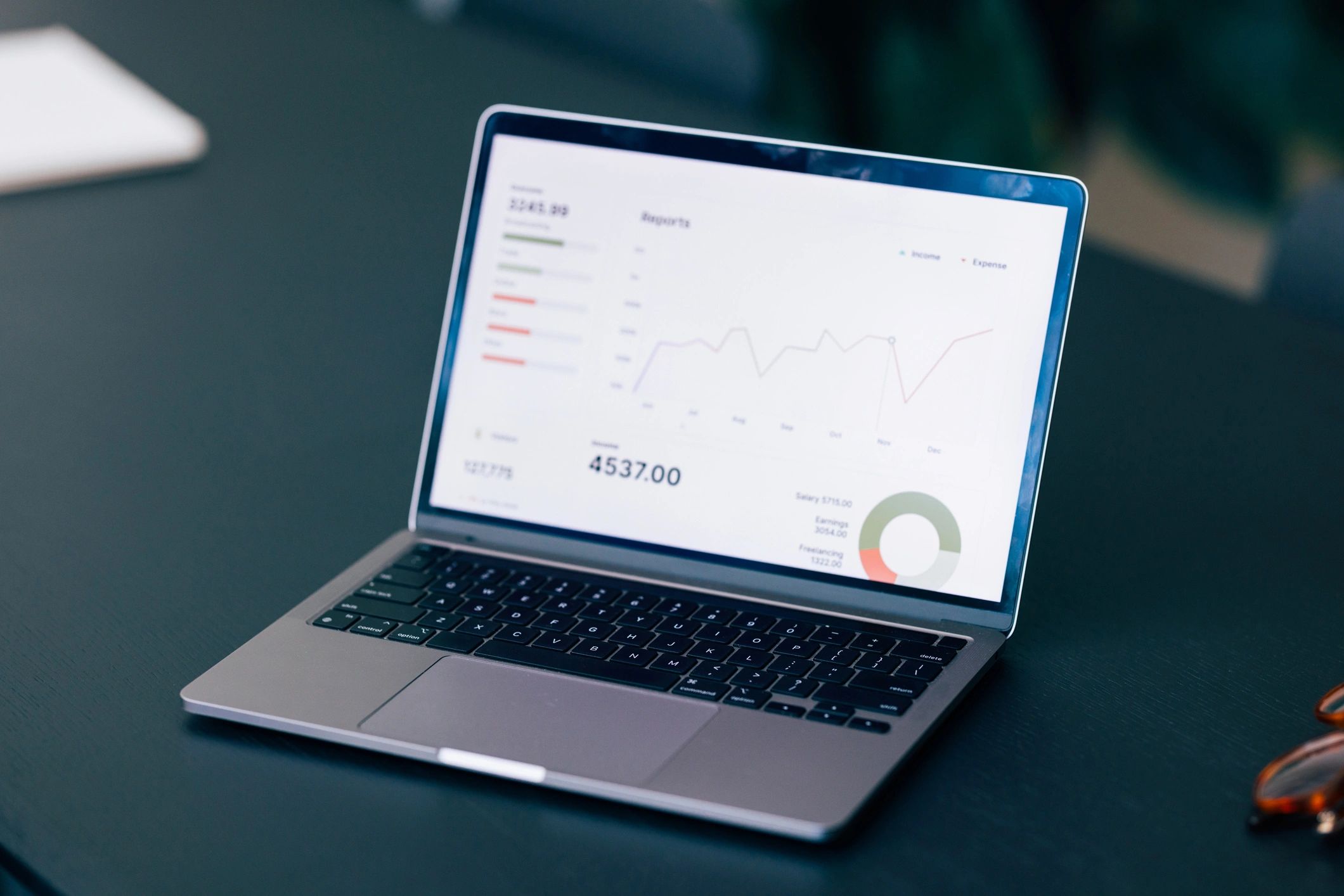 Laptop showing analytics dashboard representing service management reporting